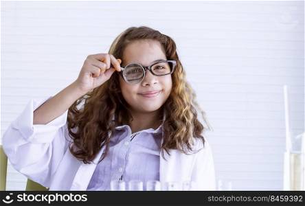 Caucasian teenage girl studying science and experiment in classroom at school. Education Concept.