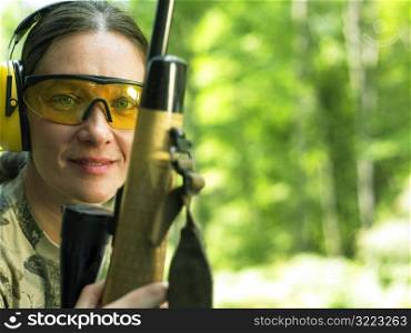 Caucasian Woman Holding A Rifle And Looking At You
