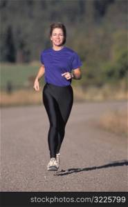 Caucasian Woman Jogging Along A Country Road