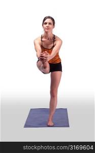 Caucasian Woman Stretching On A Blue Yoga Mat
