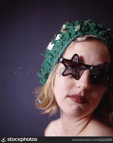 Caucasian Woman Wearing Star Sunglasses And A Goofy Hat
