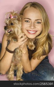 Caucasian young adult female with Yorkshire Terrier dog.