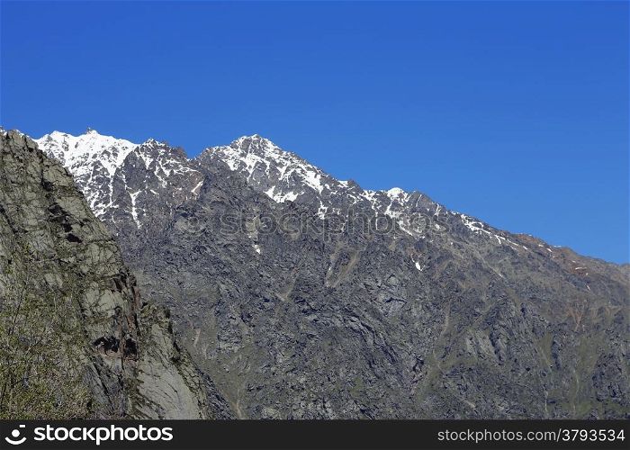 Caucasus mountains under snow and clear blue sky
