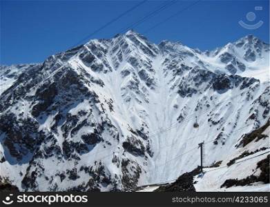 Caucasus mountains under the snow and clear sky