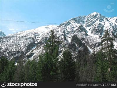 Caucasus mountains under the snow and clear sky