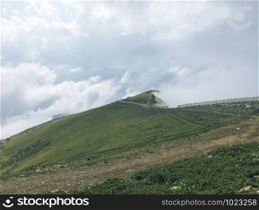 Caucasus mountains wrappednin clouds. Roza Khutor, Russia