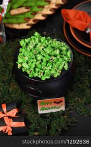 Cauldron green sweet popcorn for ghouls and zombies. Halloween treat