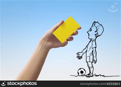 Caution card. Caricature of football player and human hand showing yellow card