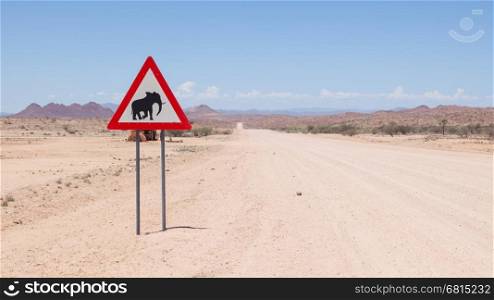 Caution: Elephants! Road sign standing beside road, Namibia, Africa