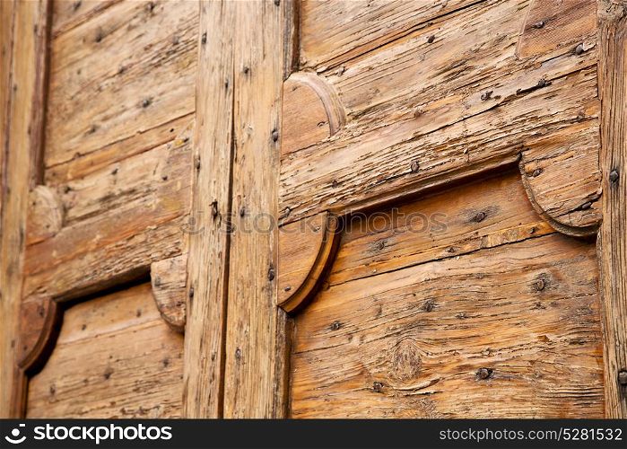cavaria abstract rusty brass brown knocker in a door curch closed wood lombardy italy varese