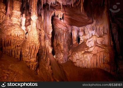 Cave dark interior. Cave dark interior with light, stalactites and stalagmites