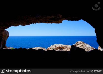 Cave hole in Barbaria Cape Formentera with mediterranean blue sea view