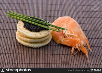 caviar and shrimp. a background photo of snack food with shrimp and caviar