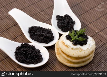 caviar. photo of some finger food with black caviar