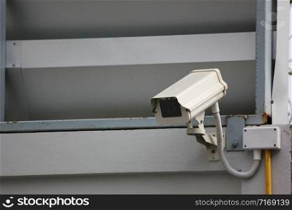 cctv camera is working on the wall. it is sending information tokeep in main office.