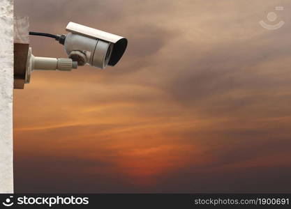 CCTV camera system on twilight sky background with copy space.