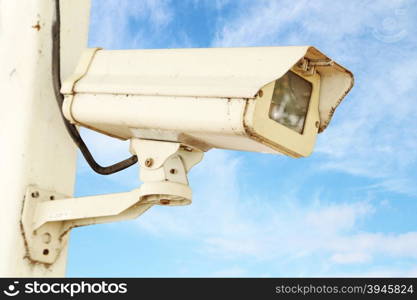 CCTV security camera with blue sky background