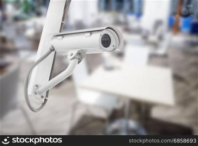 CCTV security camera with blurred restaurant background