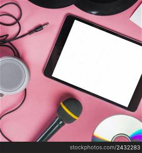 cd vinyl record microphone speaker digital tablet pink background