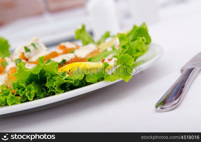 Ceasar salad served in the plate