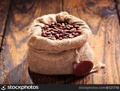 cedar nuts in a sack on wooden table
