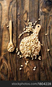 cedar nuts on wooden board, helthy food