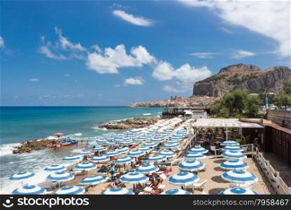 Cefalu (Italy), with the beach full of umbrellas