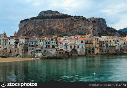 Cefalu old beautiful town beach, harbor and la Rocca view, Palermo region, Sicily, Italy.