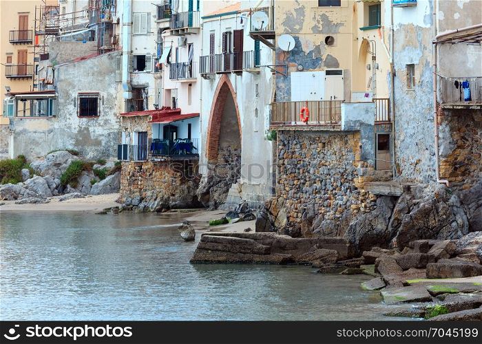 Cefalu old beautiful town houses above beach view, Palermo region, Sicily, Italy.
