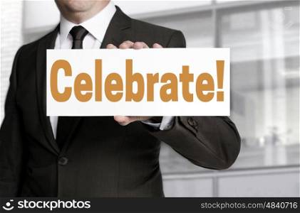 celebrate sign is held by businessman concept. celebrate sign is held by businessman concept.