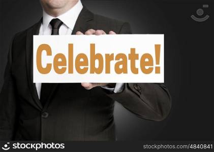 celebrate sign is held by businessman concept. celebrate sign is held by businessman concept.