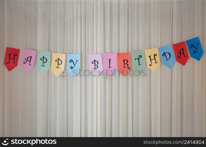 Celebrating Birthday, surprise with Happy birthday banner on wall.