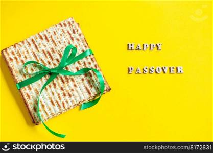 Celebrating the traditional Jewish holiday of Passover. Matzo on yellow background. Pesach matzah.. Celebrating the traditional Jewish holiday of Passover. Matzo on a yellow background. Pesach matzah.