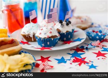 celebration and national holidays concept - food and drinks decorated for american independence day party at home. food and drinks on american independence day party