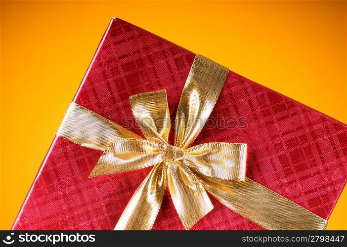 Celebration concept - Gift box against colorful background