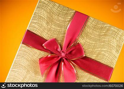 Celebration concept - Gift box against colorful background