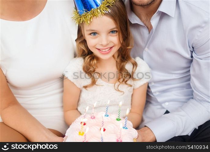 celebration, family, holidays and birthday concept - family with cake and candles