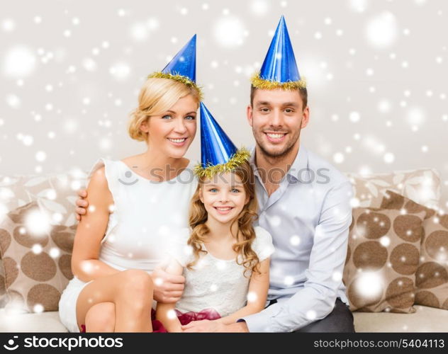 celebration, family, holidays and birthday concept - happy family in blue hats celebrating