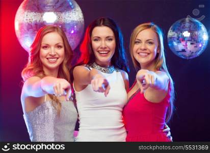 celebration, friends, bachelorette party and birthday concept - three smiling women pointing at you