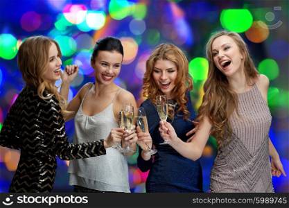 celebration, friends, bachelorette party and holidays concept - happy women clinking champagne glasses and dancing over lights background