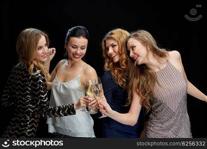 celebration, friends, bachelorette party and holidays concept - happy women clinking champagne glasses and dancing over black background