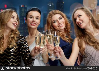 celebration, friends, bachelorette party and holidays concept - happy women clinking champagne glasses over black background