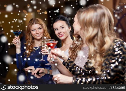 celebration, friends, bachelorette party and holidays concept - happy women drinking champagne and cocktails at night club