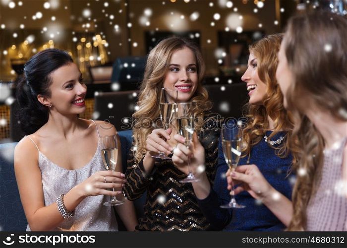 celebration, friends, bachelorette party and holidays concept - happy women with champagne glasses at night club