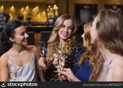 celebration, friends, bachelorette party and holidays concept - happy women with champagne glasses at night club