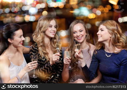 celebration, friends, bachelorette party and holidays concept - happy women with champagne glasses at night club