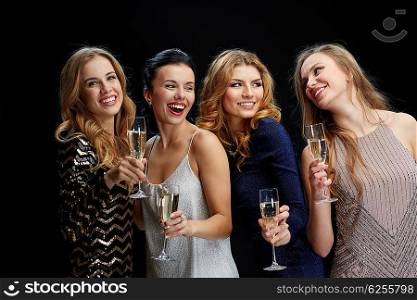 celebration, friends, bachelorette party and holidays concept - happy women with champagne glasses over black background