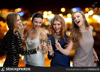 celebration, friends, bachelorette party, nightlife and holidays concept - happy women clinking champagne glasses and dancing over night lights background