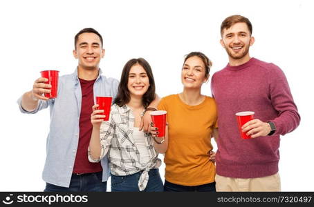 celebration, friendship and people concept - group of smiling friends with non alcoholic drinks in party cups over white background. group of smiling friends with drinks in party cups