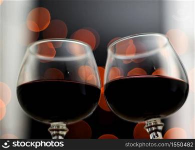 Celebration. Glasses of wine. The concept of Valentine&rsquo;s Day. Bokeh in the background of glasses.